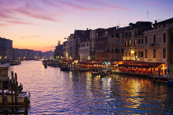 Sunset on restaurants along the Grand Canal in Venice. Veneto Italy Europe