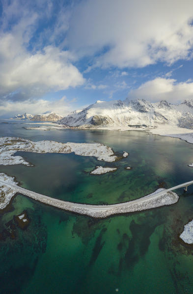 Aerial panoramic view of crystalline sea and Fredvang bridge, Lofoten Islands, Norway