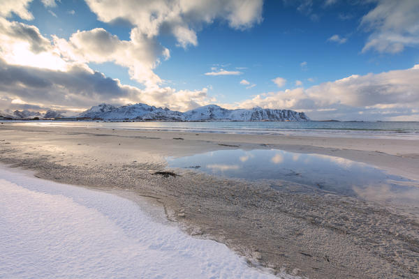 Snow on sandy beach, Ramberg, Flakstad municipality, Lofoten Islands, Norway