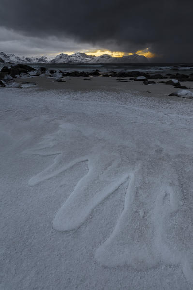 Ice on sand beach, Vikten, Flakstad municipality, Lofoten Islands, Norway