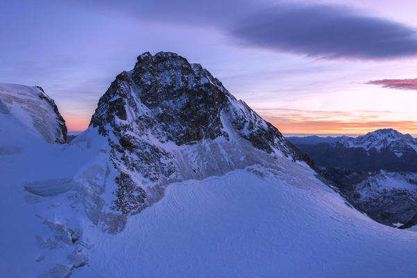 Aerial view of the snowy peak of Cresta Guzza towards Piz Bernina, Valmalenco, Lombardy, border of Italy and Switzerland