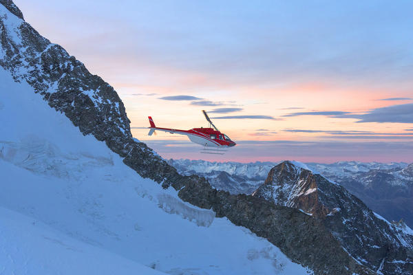 Aerial view of helicopter in flight on Piz Morteratsch, Bernina Group, Valmalenco, Lombardy, border of Italy and Switzerland
