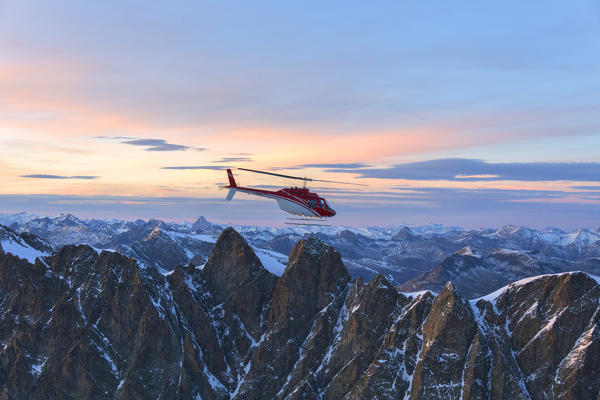Aerial view of helicopter in flight on Pizzi Gemelli toward Piz Bernina, Valmalenco, Lombardy, border of Italy and Switzerland