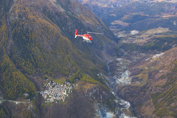 Aerial view of helicopter in flight on Primolo, Valmalenco, Valtellina, Lombardy, province of Sondrio, Italy