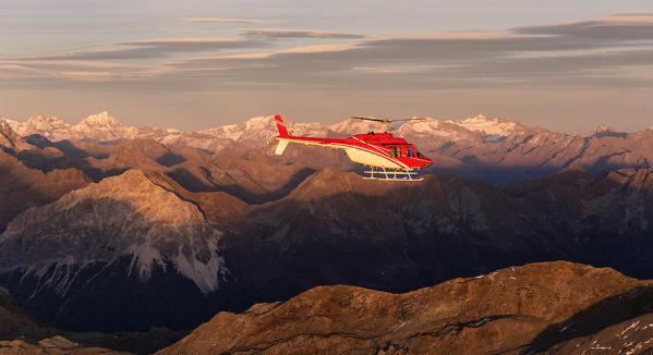 Aerial view of helicopter in flight towards Mount Ortles and Gran Zebrù, Valmalenco, Valtellina, Lombardy, Italy
