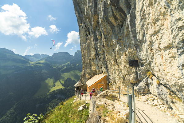Hikers on walkway, Wildkirchli, Ebenalp, Appenzell Innerrhoden, Switzerland