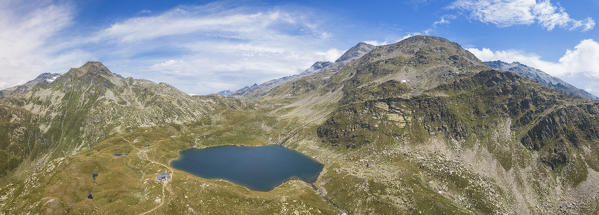 Aerial panoramic of Lake Emet, Rifugio Bertacchi and peak Emet, Spluga Valley, Sondrio province, Valtellina, Lombardy, Italy