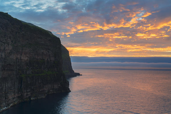 Sunset on cliffs overlooking the ocean, Gjogv, Eysturoy island, Faroe Islands, Denmark