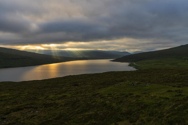 Sun rays above Lake Leitisvatn (Sorvagsvatn), Vagar island, Faroe Islands, Denmark