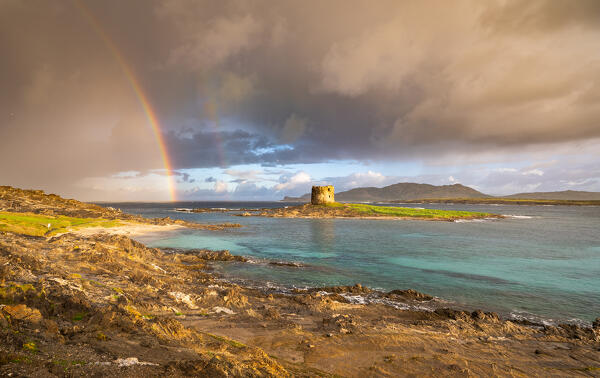 Rainbow on La Pelosa beach, Stintino, Sassari province, Sardinia, Italy, Europe.