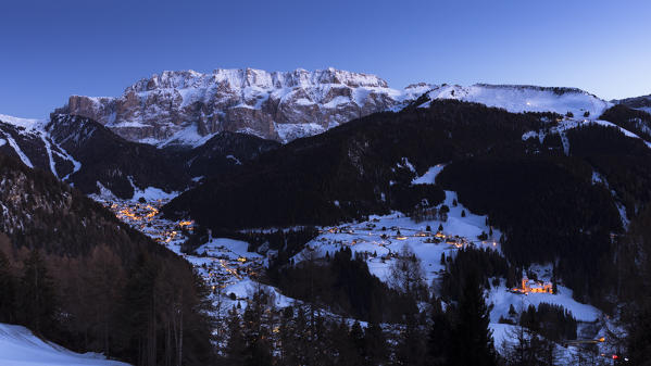 the blue hour on Wolkenstein in Val Gardena, with the Sella Group in the backgrouns, Bolzano province, South Tyrol, Trentino Alto Adige, Italy