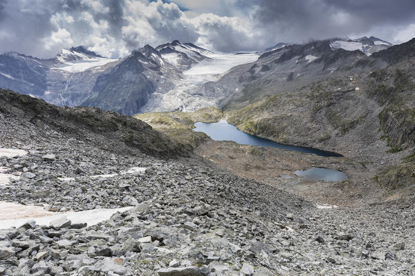 a view of the Lagoscuro Lake in the Natural Park of Adamello Brenta, with the Adamello Glacier in the background, Trento province, Trentino Alto Adige, Italy