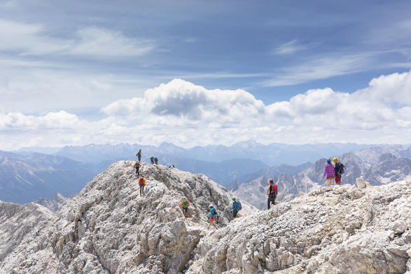 A lot of climbers on the top of the Kesselkogel Peak, Bolzano province, South Tyrol, Trentino Alto Adige, Italy