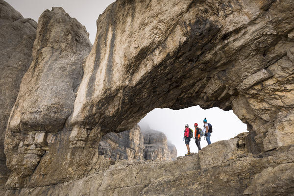Climbers along the via ferrata Gianni Aglio on the Tofana di Mezzo, Belluno province, Veneto, Italy