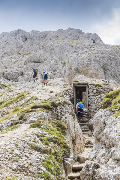 Climbers on the via ferrata along the frontline of the World War 1 to the top of the Sass de Stria, Belluno province, Veneto, Italy