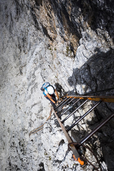 A climber along the via ferrata Merlone on the Cadini di Misurina, Belluno province, Veneto Italy