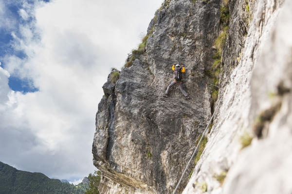 a climber along the via ferrata Costantini on the Monte Civetta, Belluno province, Veneto, Italy