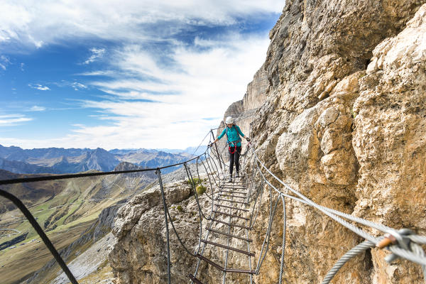 A climber along the via ferrata Piazzetta on the Sella Group, Bolzano province, South Tyrol, Trentino Alto Adige, Italy