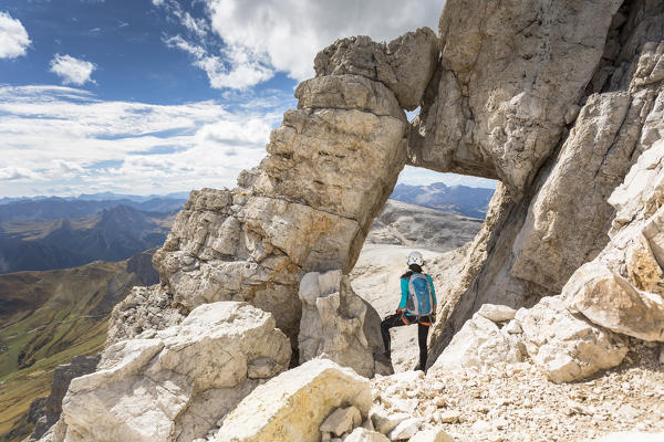A climber along the via ferrata Cesare Piazzetta on the Sella Group, Bolzano province, South Tyrol, Trentino Alto Adige, Italy