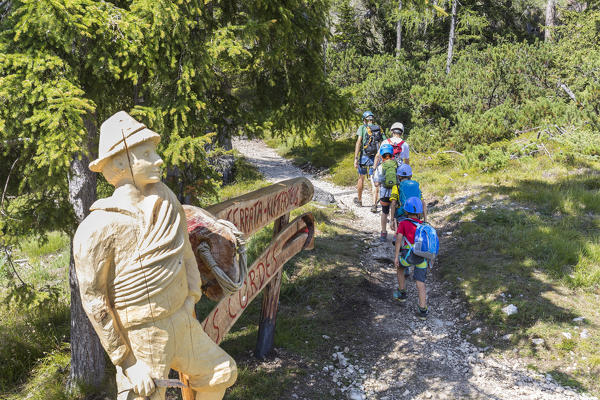 a group of hikers are going to climb the via ferrata (iron path) Les Cordes in the Dolomites, Bolzano province, South Tyrol, Trentino Alto Adige, Italy