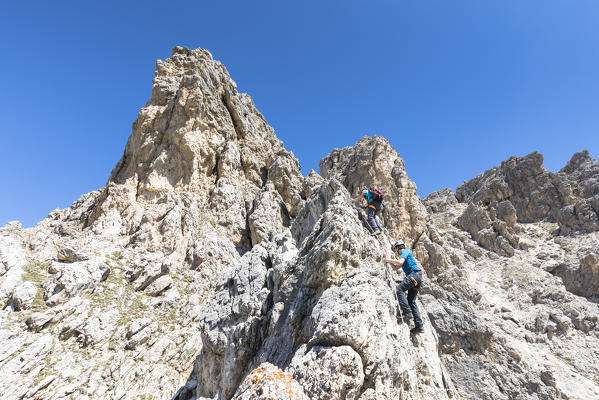climbers along the via ferrata Small Cir with the Sella Group in the background, Bolzano province, South Tyrol, Trentino Alto Adige, Italy