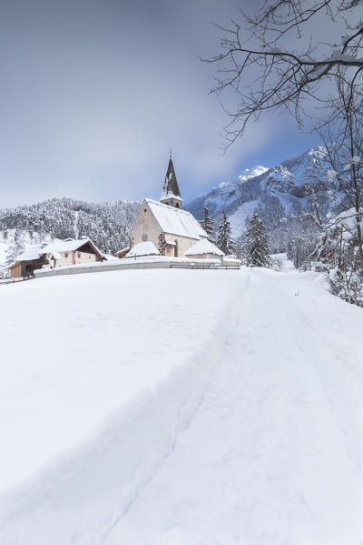 the famous little church of St. Magdalena in Villnöss after a snowfall, Bolzano province, South Tyrol, Trentino Alto Adige, Italy, 