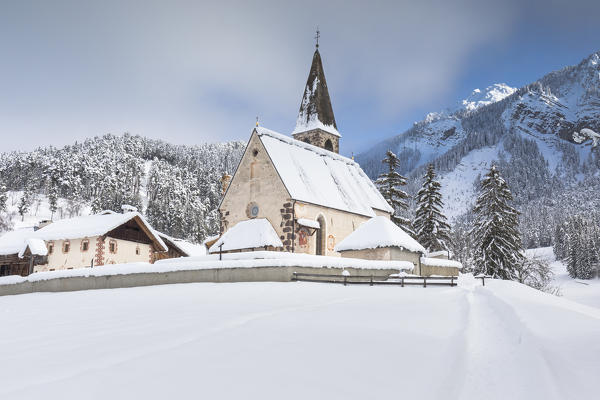 the famous little church of St. Magdalena in Villnöss after a snowfall, Bolzano province, South Tyrol, Trentino Alto Adige, Italy, 