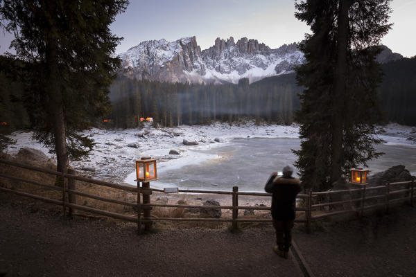 sunset at Karersee during the Christmas market in a particolar atmosphere
