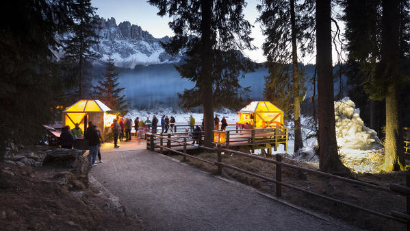 sunset at Karersee during the Christmas market in a particolar atmosphere