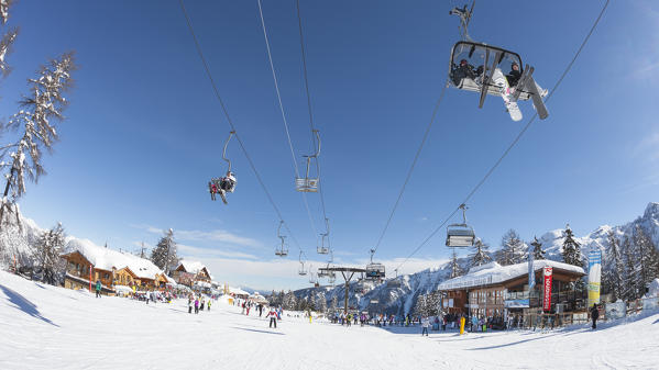 a fisheyed view of the Folgarida ski resort with a lot of tourists on the slopes, Trento province, Trentino Alto Adige, Italy, Europe