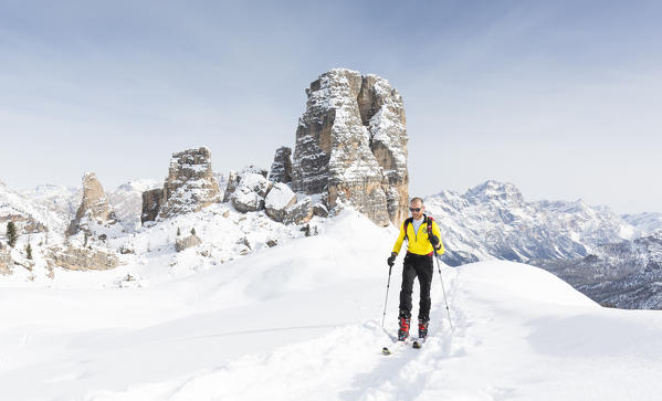 a view of a skier during a ski mountaineering tour with the Cinque Torri in the background, Belluno province, Veneto, Italy, Europe