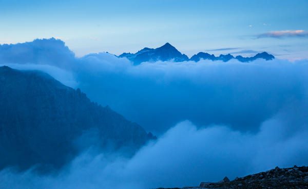 a beautiful sunrise on the Adamello Group, from the Brenta Group, with cloud in the valleys, Trento province, Trentino Alto Adige, Italy, Europe,