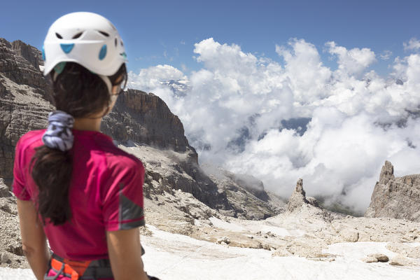 a view of the Brenta Group, witha model in foreground looking to the horizon, Trento province, Trentino Alto Adige, Italy, Europe,