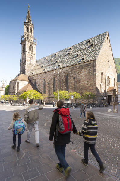 a view of the Bolzano Cathedral with some tourists in foreground, Bolzano province, South Tyrol, Trentino Alto Adige, Italy, Europe,