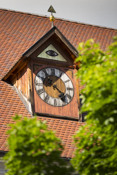 detail of the church roof of Sarntal with a beautiful painted clock, Bolzano province, South Tyrol, Trentino Alto Adige, Italy,