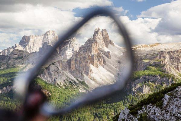 a view of the Croda da Lago seen through a carabiner, Belluno province, Veneto, Italy