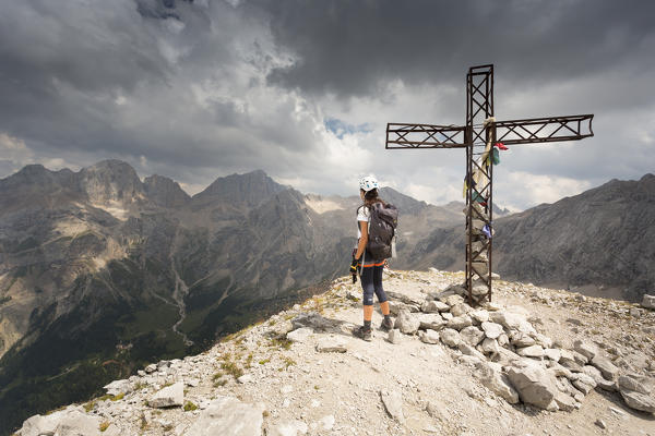 a hiker is looking the Panorama from the top of the mountain, Trento province, Trentino Alto Adige, Italy