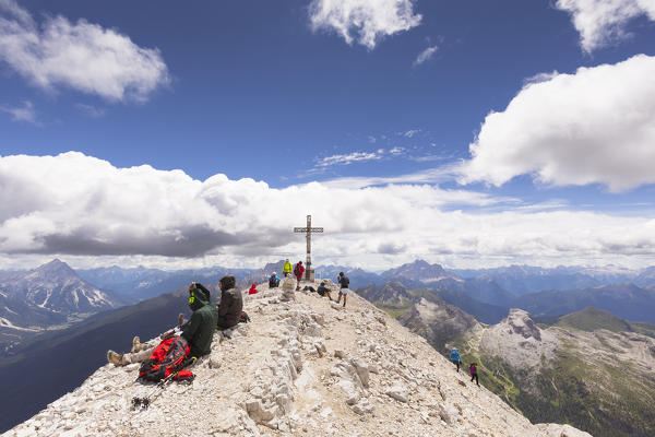 a view of the Tofana di Rozes Peak with several hikers, Belluno province, Veneto, Italy