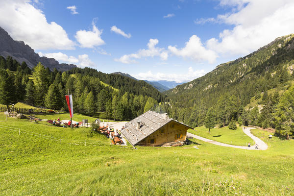 a view of the Kaserill Alm with the Geisler Gropu in the background, Villnössertal, South Tyrol, Trentino Alto Adige, Italy,