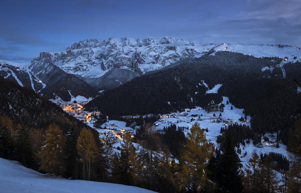 an evening view of the village of Selva Gardena, with the Sella Group in the background, Bolzano province, South Tyrol, Trentino Alto Adige, Italy 