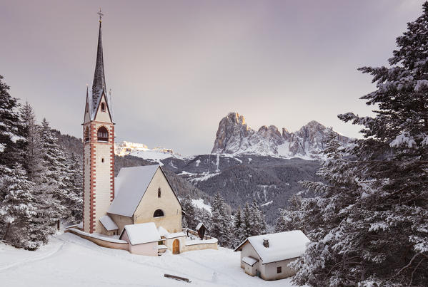  a beautiful sunset by the Church of San Giacomo in Val Gardena with Langkofel and Plattkofel in the background, Bolzano province, South Tyrol, Trentino Alto Adige, Italy