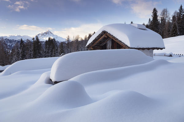 a suggestive view of an alpine pasture after a recent snowfall in Val Badia, Bolzano province, South Tyrol, Trentino Alto Adige, Italy