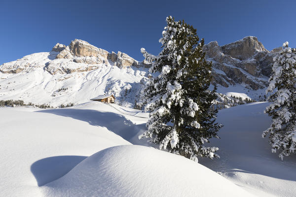 a suggestive view of a little hut surrounded by idyllic winter environment in Val Gardena, Bolzano province, South Tyrol, Trentino Alto Adige, Italy, 