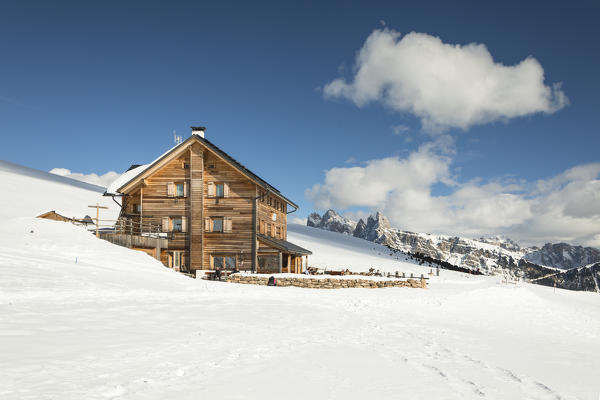 a view of the Raschötz Mountain Hut in Val Gardena with the Geisler Group in the background, Bolzano province, South TYrol, Trentino Alto Adige, Italy