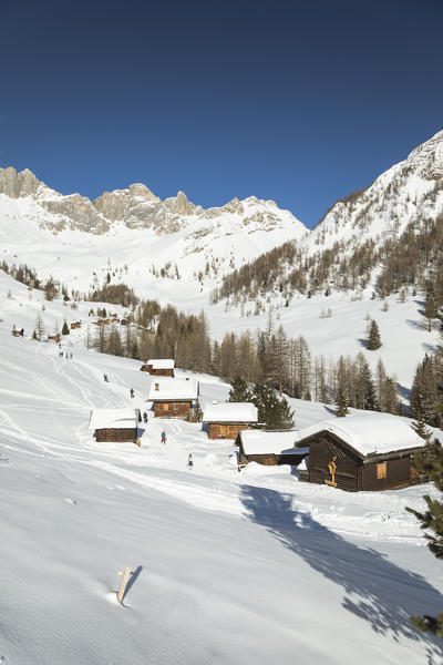 the typical mountain huts in Valfredda, a dolomitic valley near the San Pellegrino Pass, Belluno province, Veneto, I