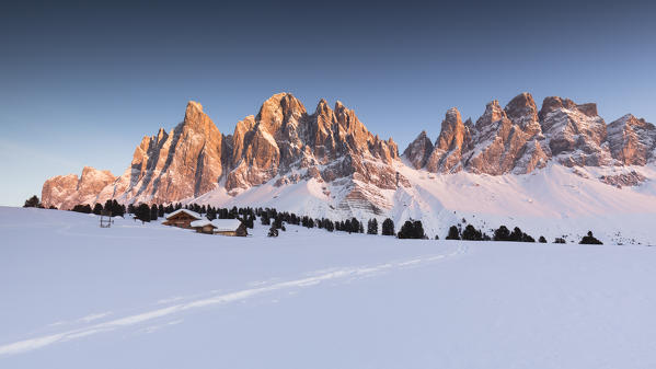 a beautiful winter sunset on the Geisler in Villnössertal, Bolzano province, South Tyrol, Trentino Alto Adige, Italy