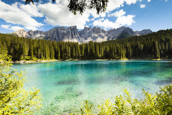 a view of the Karersee with its unique colors and with the Latemar in the background, Bolzano province, South Tyrol, Trentino Alto Adige, Italy,