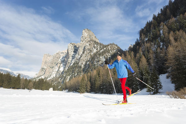 a skier on a croos-country slope in Val Gardena, Bolzano province, South Tyrol, Trentino Alto Adige, Italy