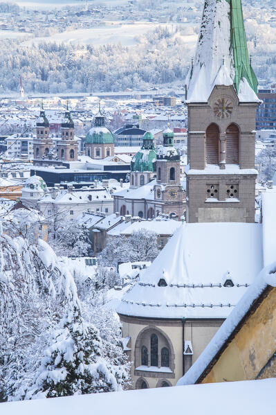 The snow covered roofs of the Jesuit church, the Sankt Nikolaus church and of the cathedral after a snowy morning, Innsbruck, Tyrol, Austria, Europe
