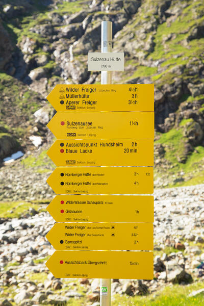 Signage for hikers in transit on Stubai Hight Trail, Sulzenau Hütte, Neustift im Stubaital, Innsbruck Land, Tyrol, Austria, Europe